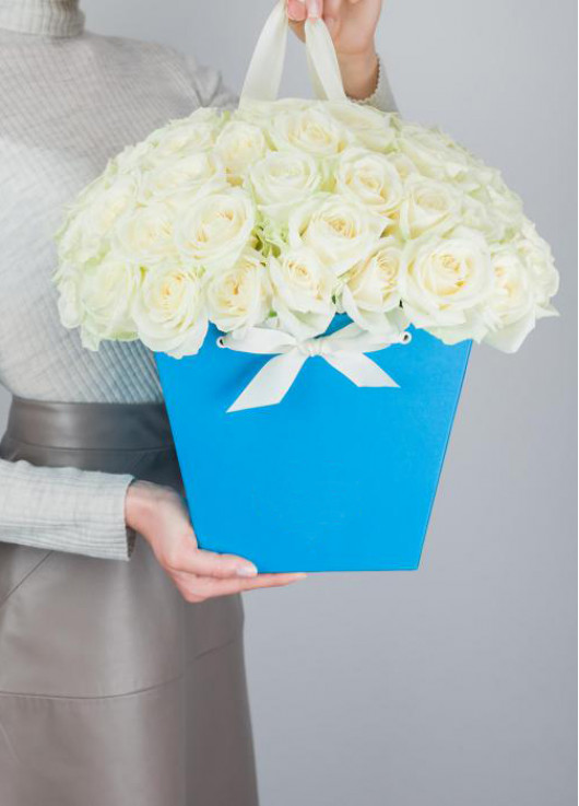 39 white roses in a bag-basket