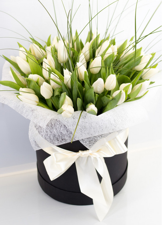 White tulips in a hat box