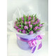 Violet tulips in a hat box