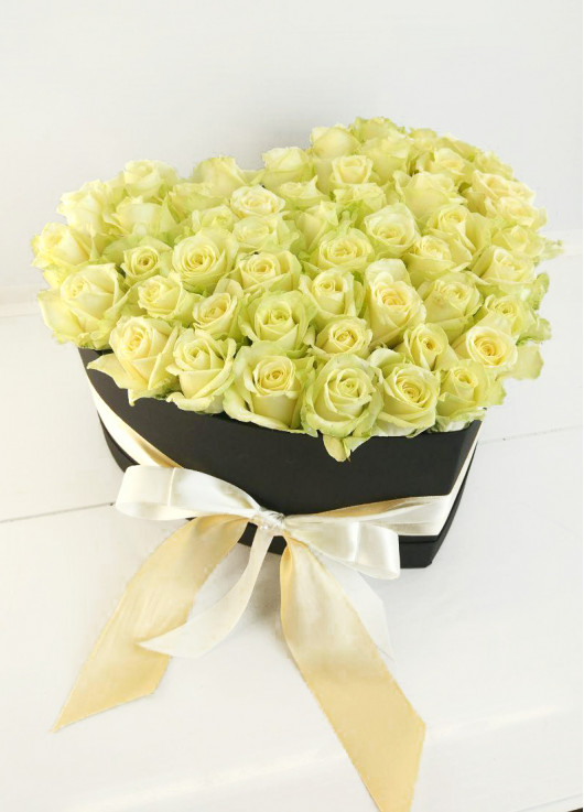 White roses in a heart box