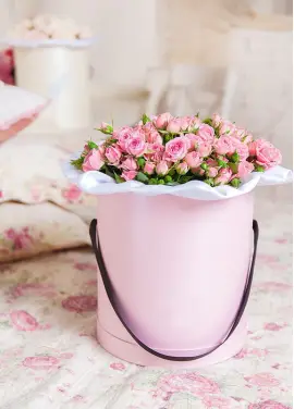 Bush roses in a hatbox