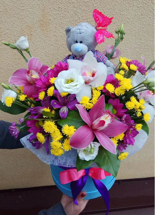 Presents flowers and teddy