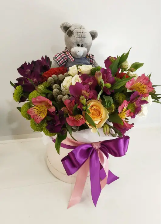 Presents flowers and teddy