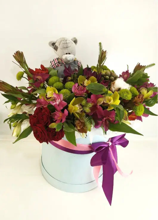 Presents flowers and teddy
