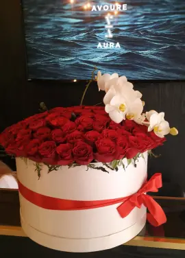 Orchids and roses  in a hat box