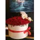 Orchids and roses  in a hat box
