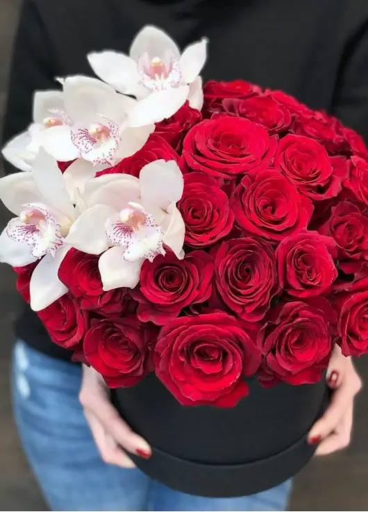 Orchids and roses  in a hat box