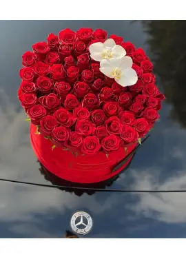 Orchids and roses  in a hat box