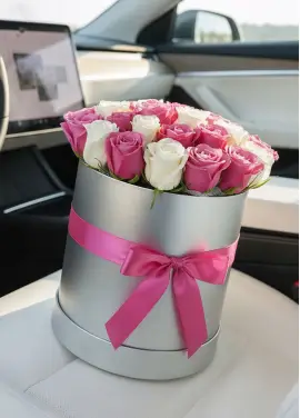 25 white and pink roses in a box