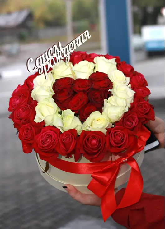 35 red and white roses in a box