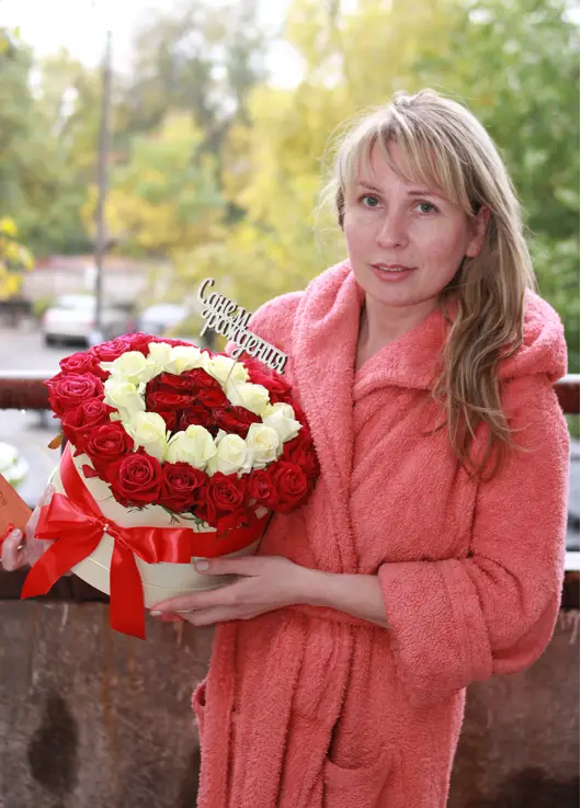 35 red and white roses in a box