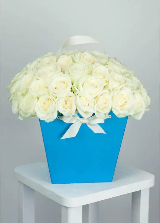 39 white roses in a bag-basket