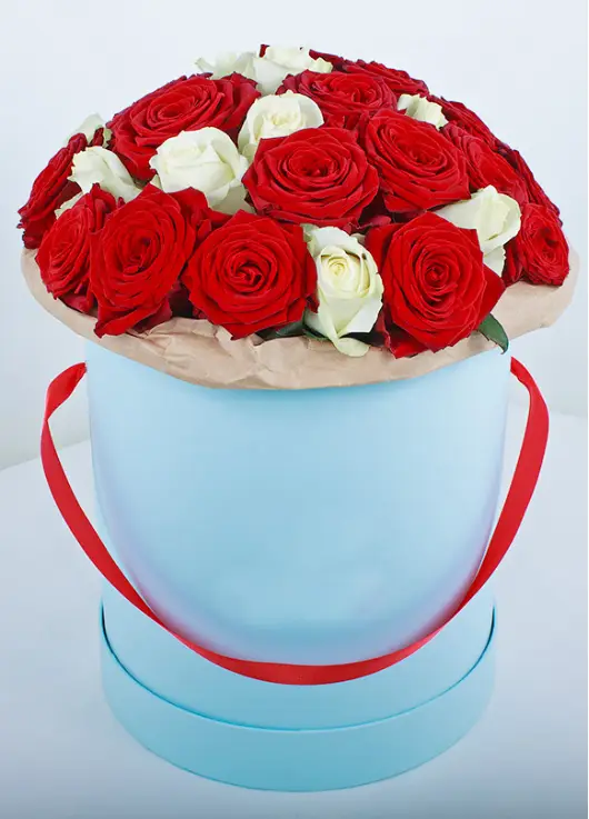 35 red and white roses in a box
