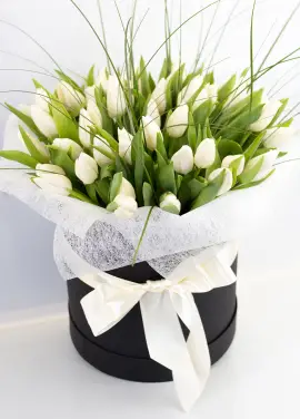 White tulips in a hat box