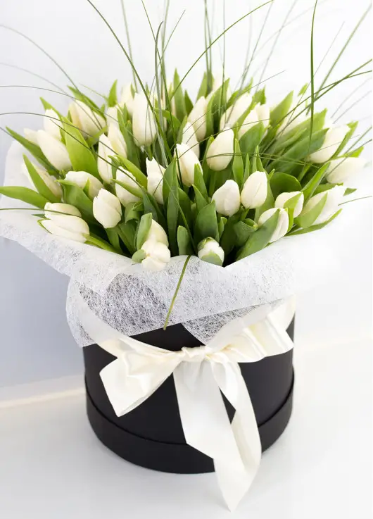 White tulips in a hat box White tulips in a hat box