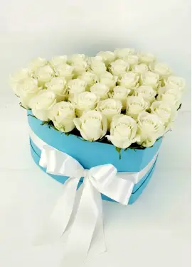 35 white roses in a heart box