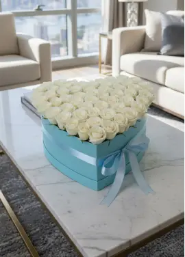 75 white roses in a heart box