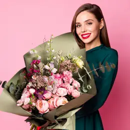 Recipient accept flowers and pose for photo report